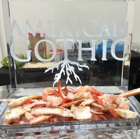 Carved restaurant logo over a chilled seafood display