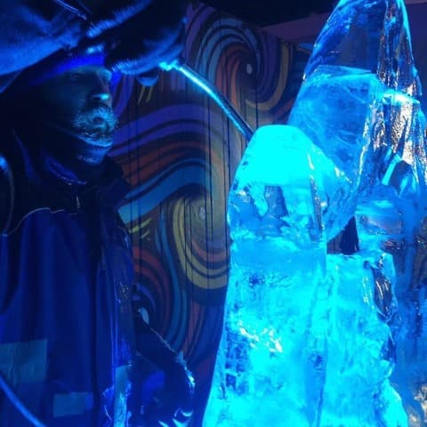Live ice carving under stage lighting