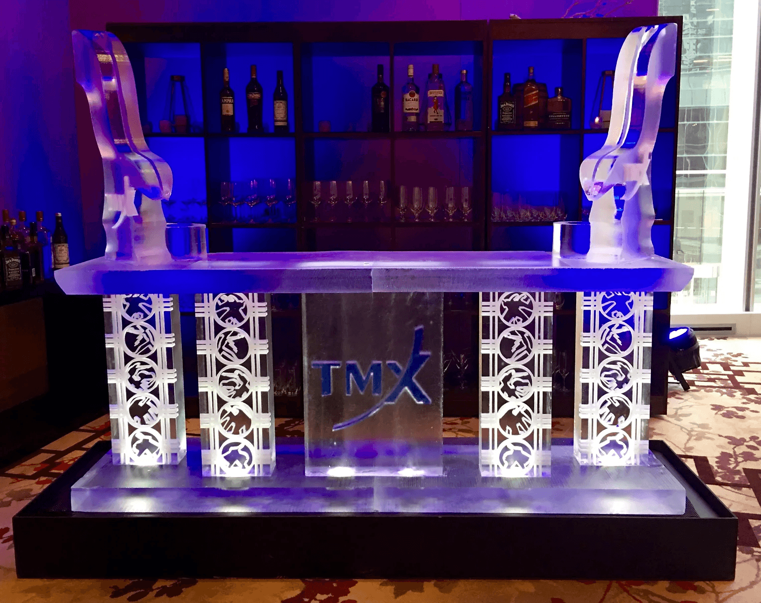 A branded corporate ice bar with dramatic blue lighting